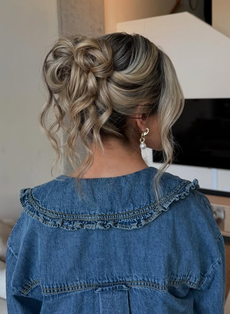 Casual messy bun with blonde highlights