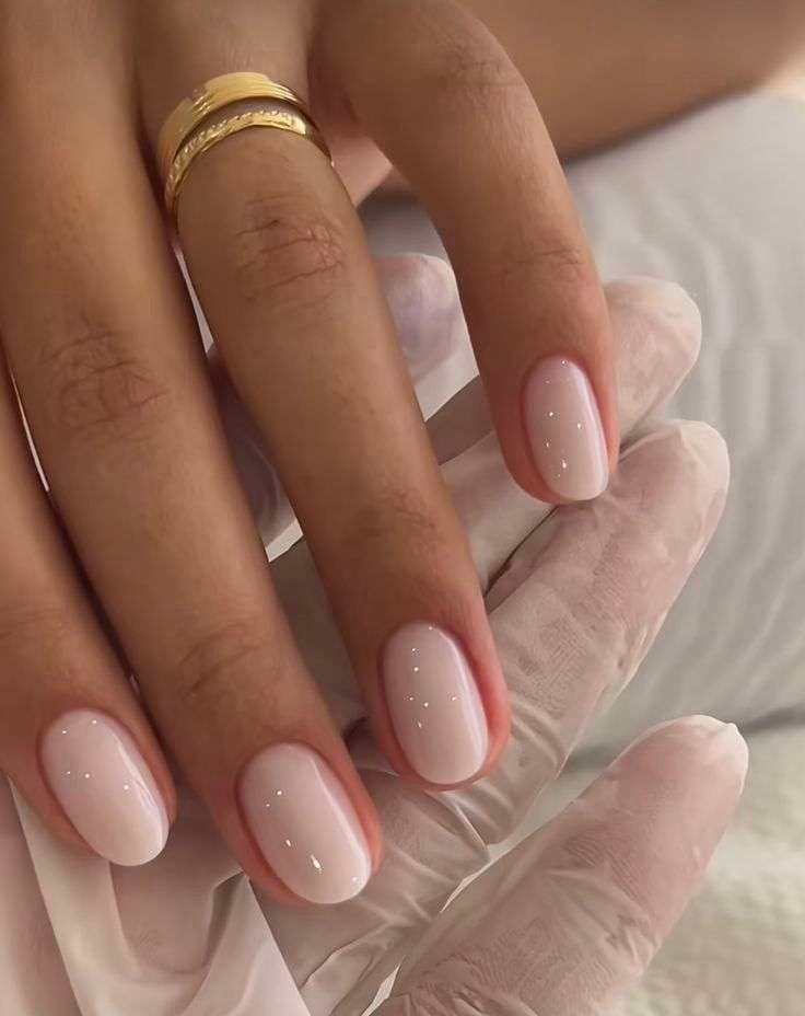 Serene milky pink nails for a soft and elegant look.
