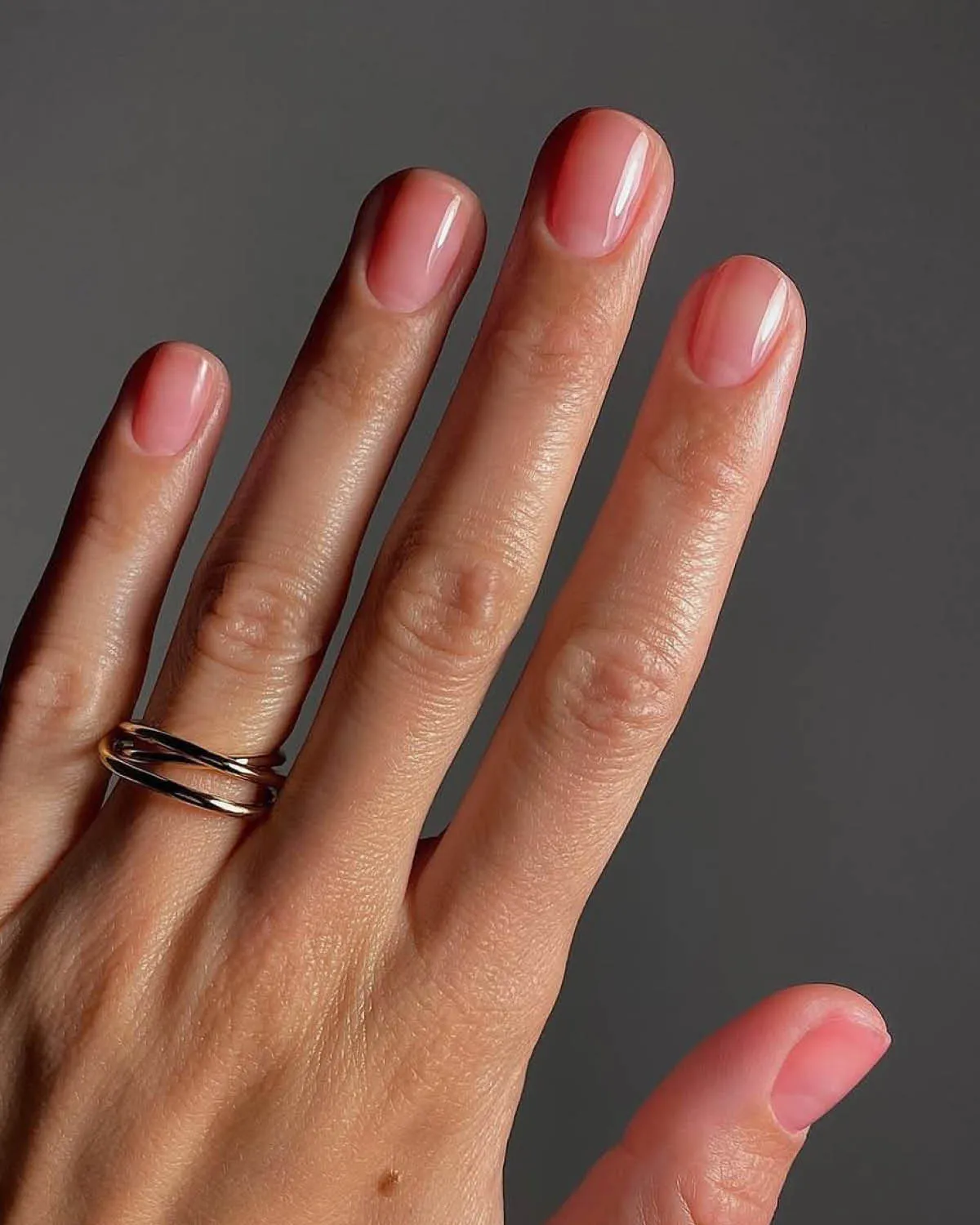 Natural glossy nude nails for an understated, elegant look.