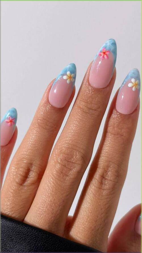 Floral nails with blue ombré for a springtime vibe.