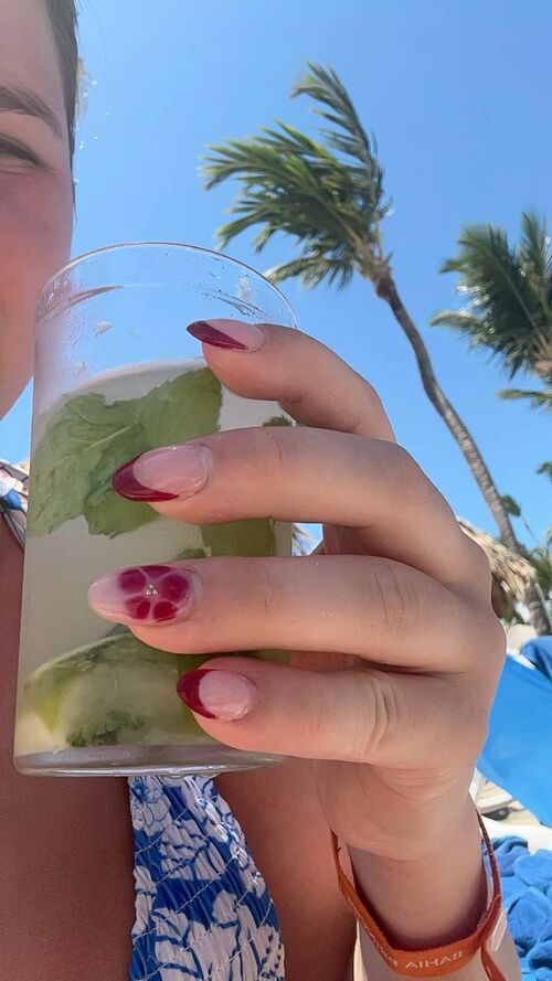 Chic burgundy tip nails for a sophisticated look.