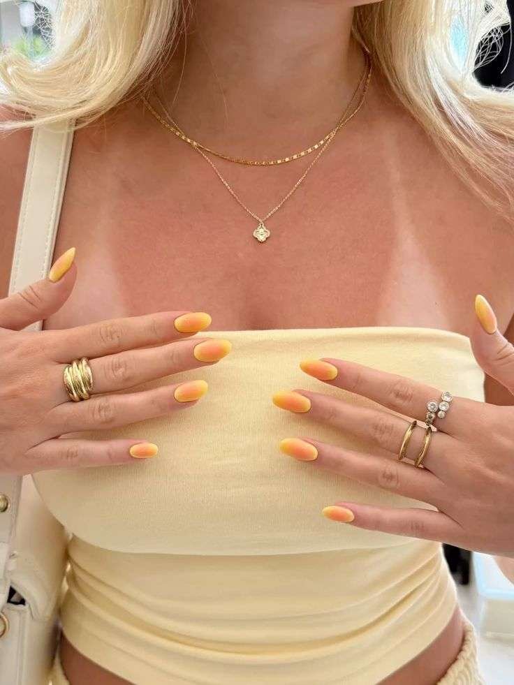Sunny citrus delight nails with vibrant yellow.