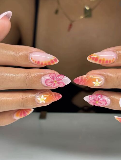 Tropical blossom nails with sunset gradient.
