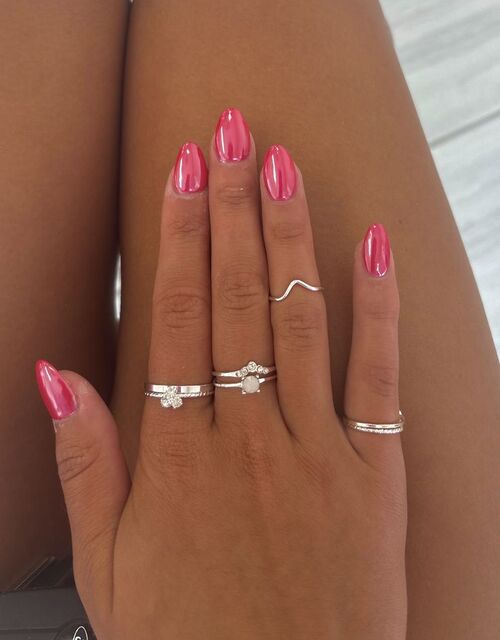 Vivid hot pink nails for a glamorous look.