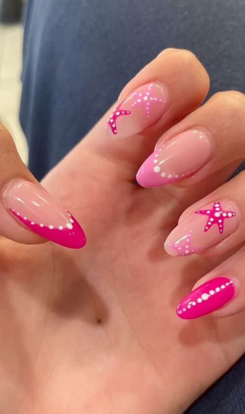 Playful pink nails with star accents.