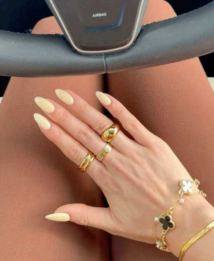 Chic almond-shaped beige nails.