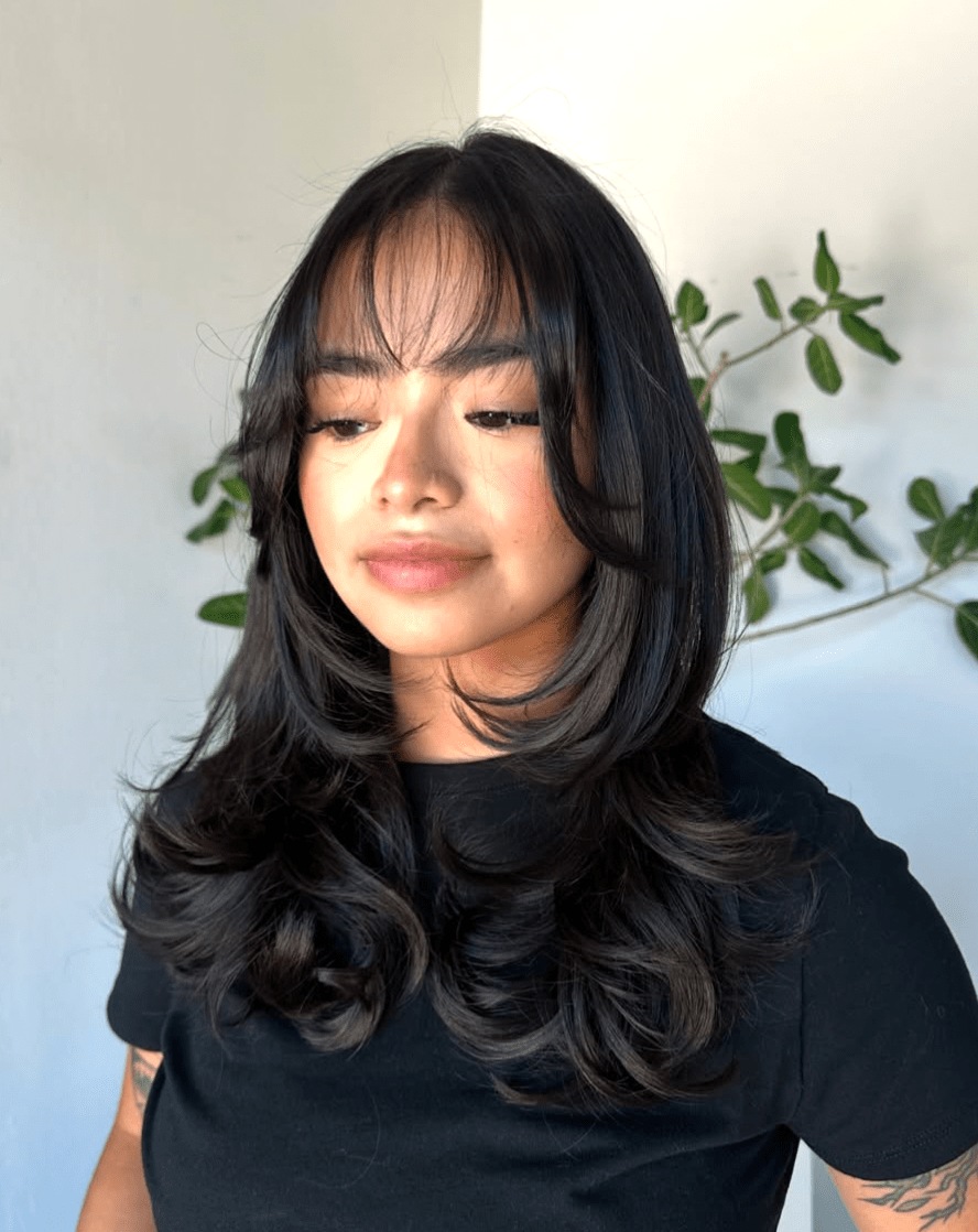 Long layers with curtain bangs and shine