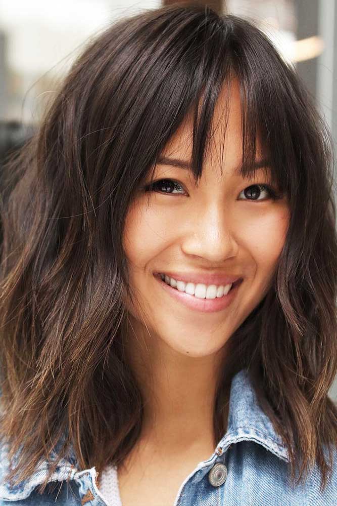 Textured bob with wispy bangs and volume