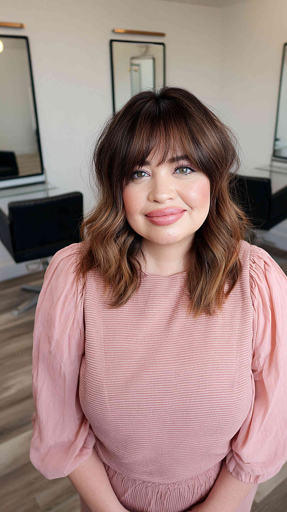 Classic bob with wispy fringe and sleek finish