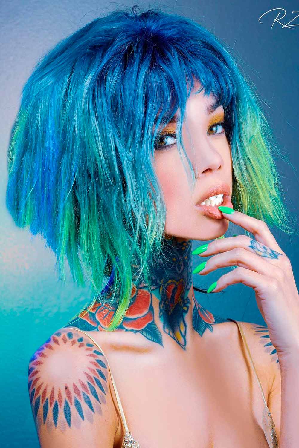 Vibrant bob with textured bangs and bold color