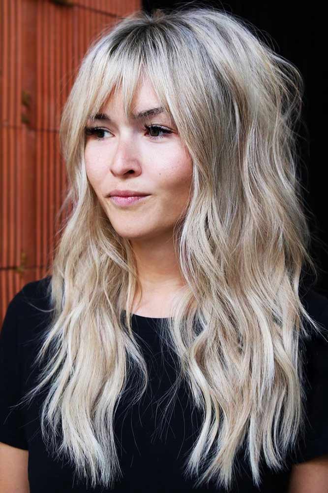 Textured waves with feathered bangs and volume