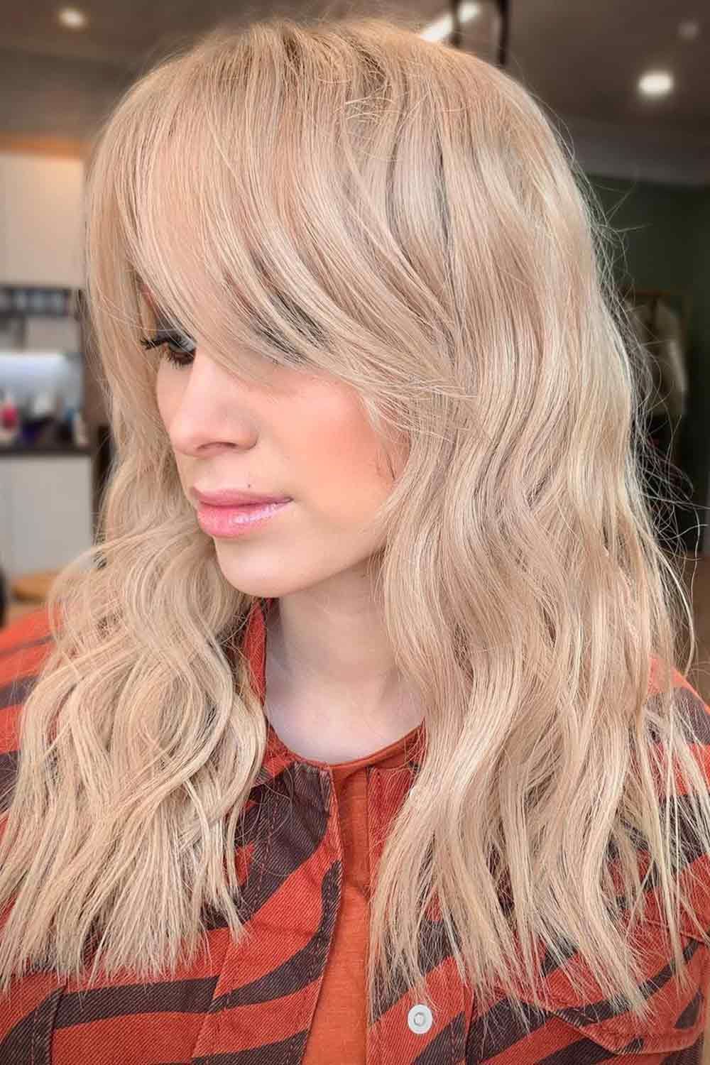 Soft blush waves with curtain bangs