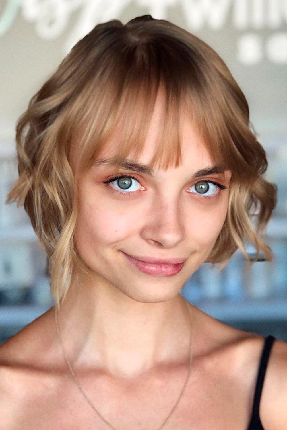 Chic wavy bob with textured bangs