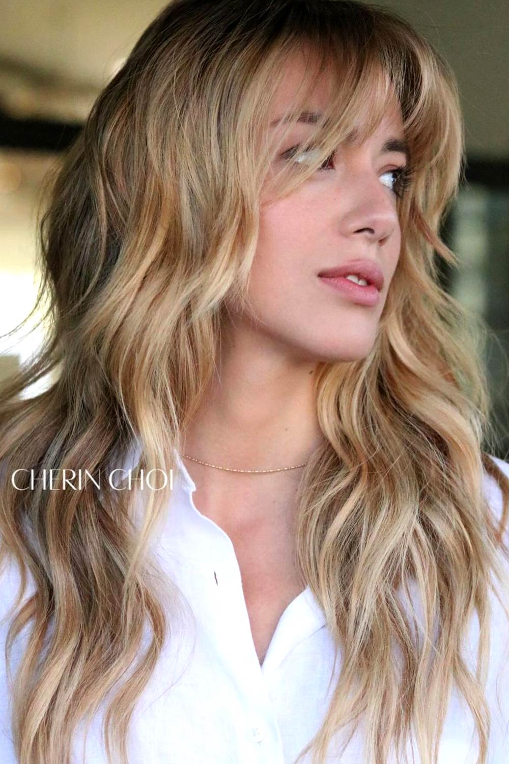 Golden waves with wispy bangs and shine