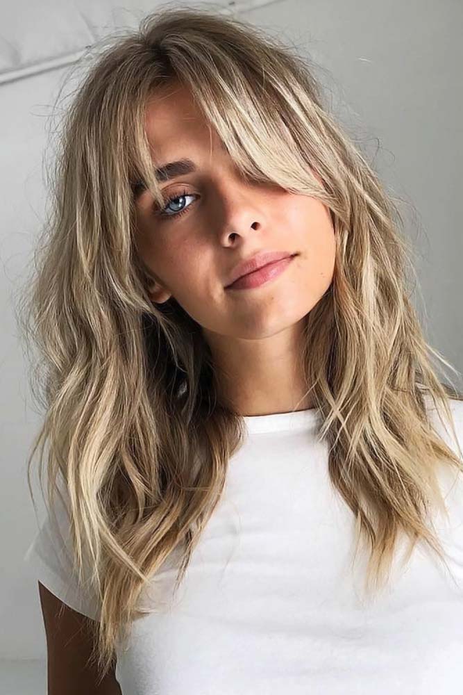 Effortless blonde waves with wispy fringe
