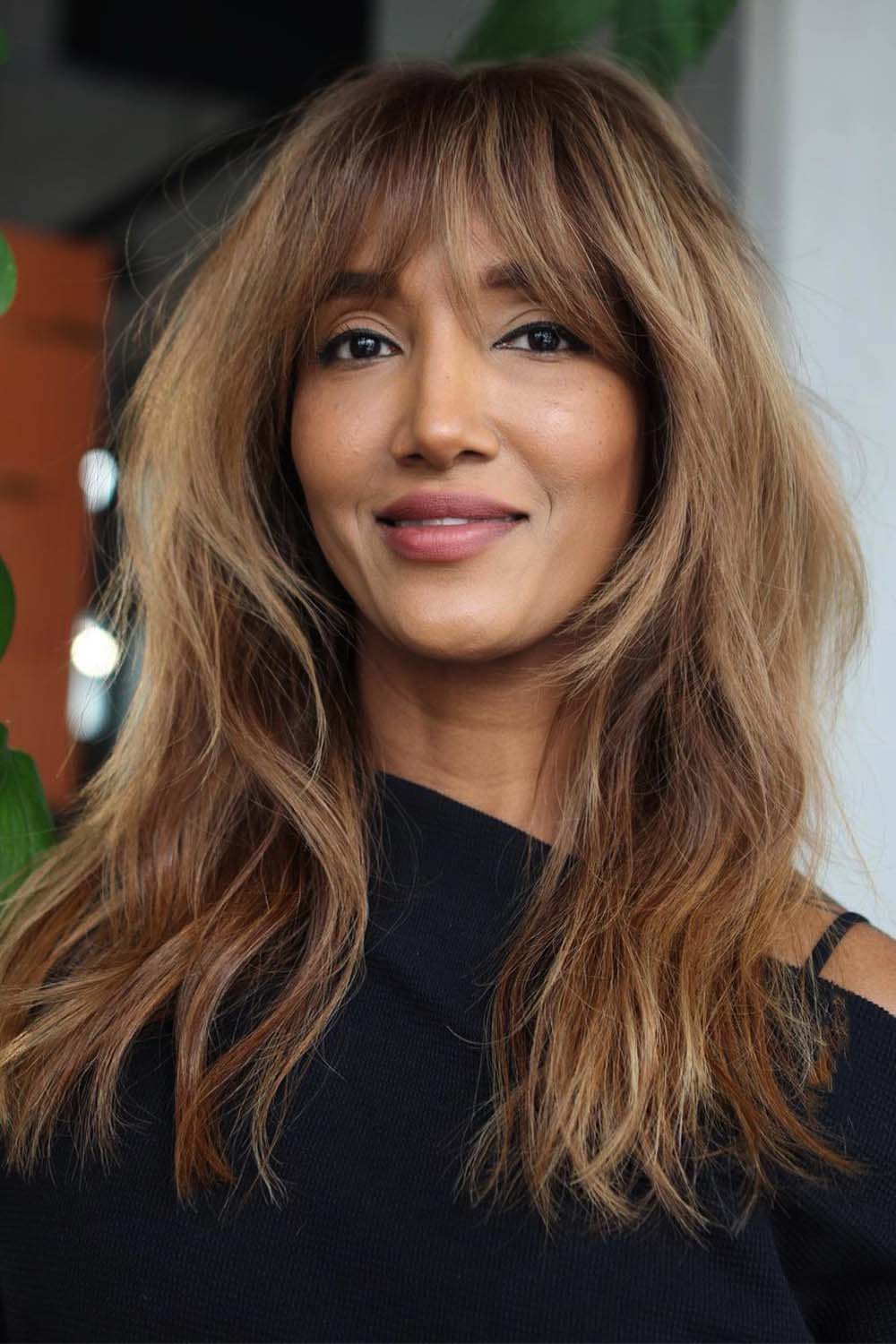 Textured layers with warm wispy bangs