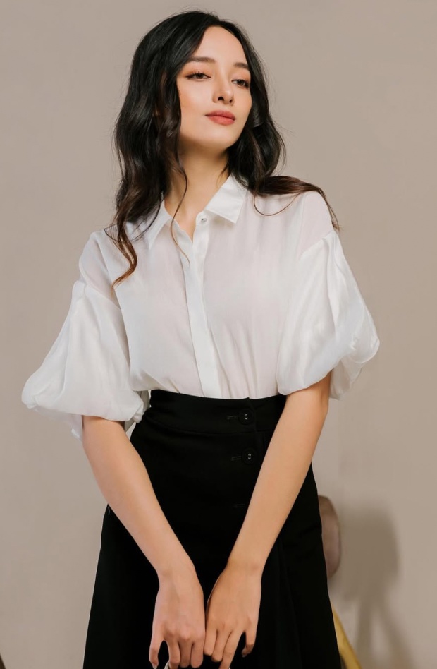 White puff sleeve shirt with black skirt