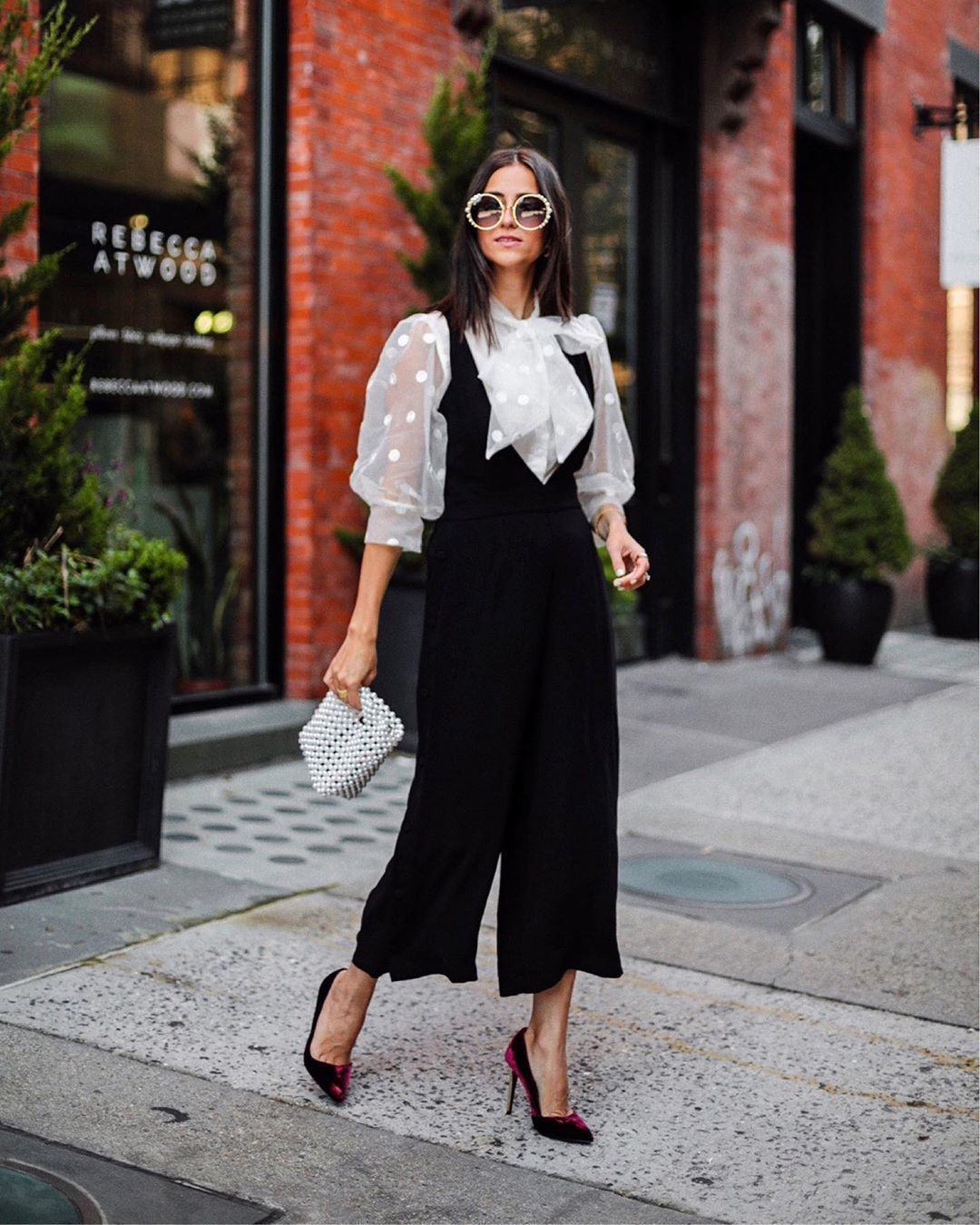 Sheer blouse with black jumpsuit